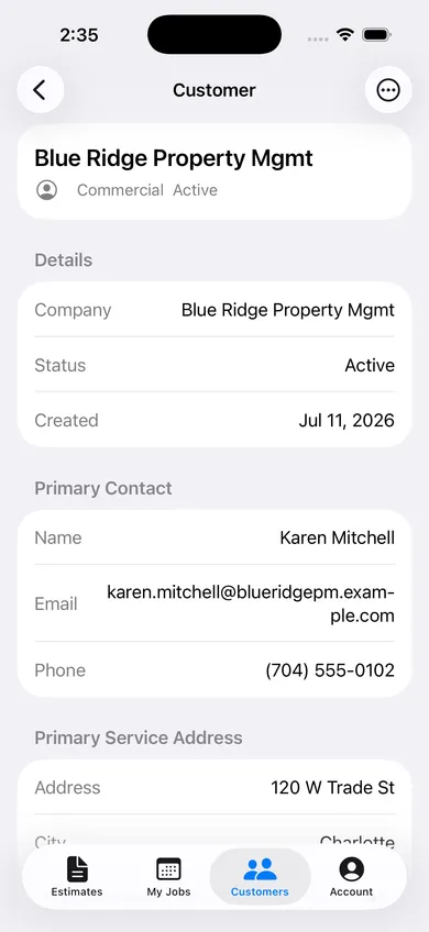 Customer detail screen for a commercial account showing company info, primary contact, and service address